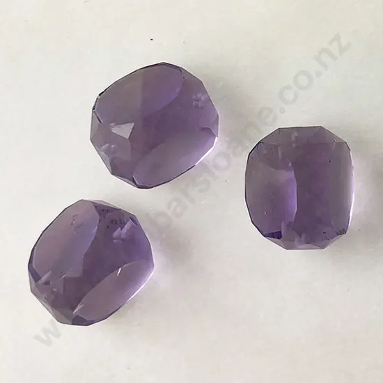 Three Unmounted Amethyst Stones