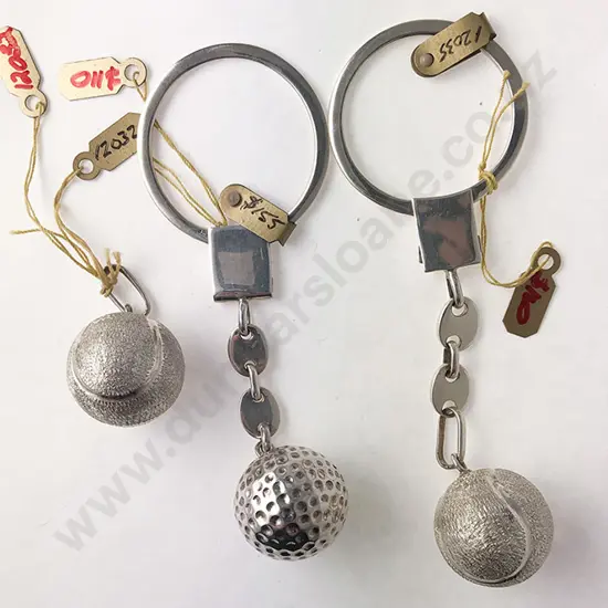 Two S/S Key Rings mounted with golf and tennis ball pendants