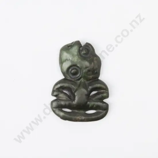 A Pre C19th Carved Maori Greenstone Hei Tiki. Head tilted to left shoulder