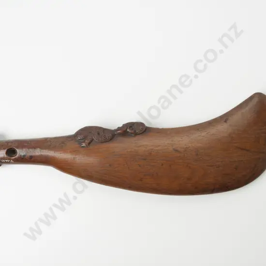 A Pre C19th Maori Carved Wooden Wahaika. Of relatively thick form with full carved female figure to inside blade