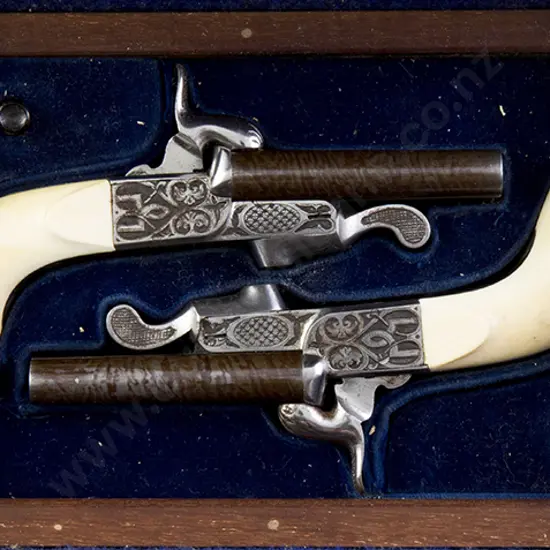 Cased Pair Ivory Handled Muff pistols