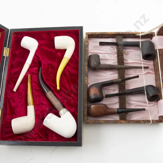 Two Cased Displays Of Pipes