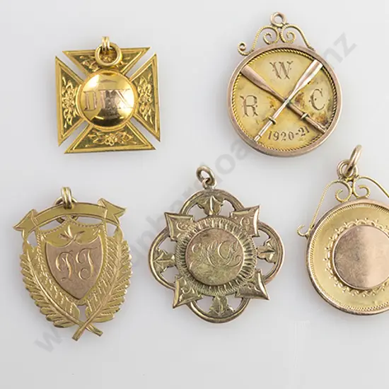 Five Various 9ct Gold Prize Medals