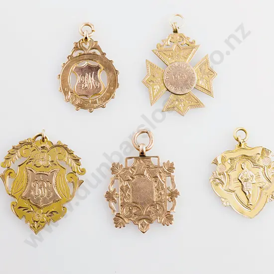 Five Various 9ct Gold Prize Medals
