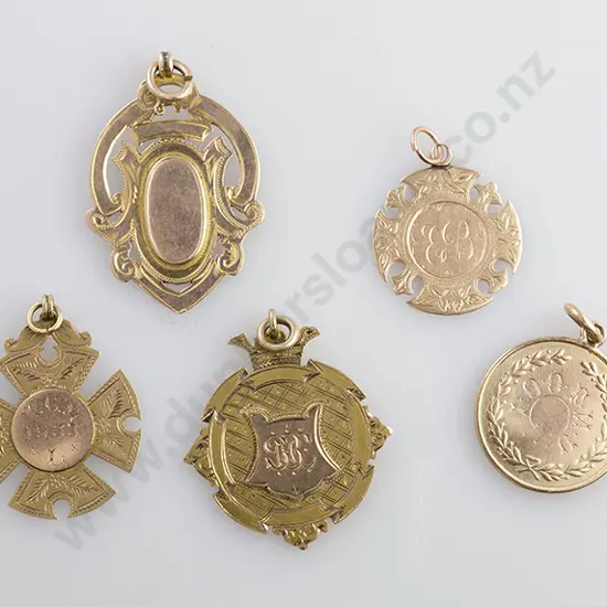 Five Various 9ct Gold Prize Medals