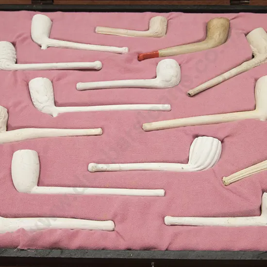 Cased Display Of 14 Clay Pipes