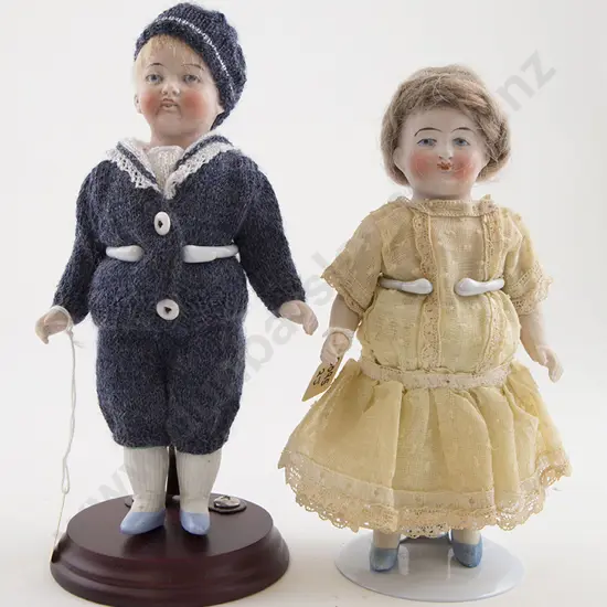 Two All Bisque Boy and Girl Dolls