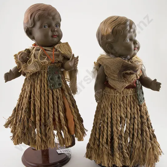 Two Brown Celluloid Character Toddler Dolls with Maori dress