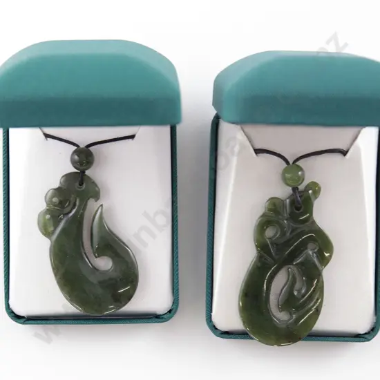 Two Greenstone Fish Hook Pendants