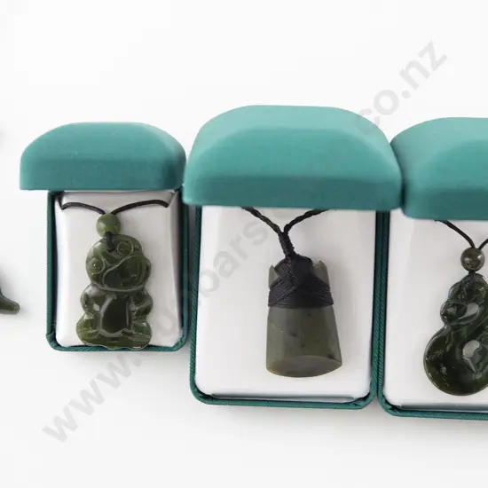 Four Greenstone Pendants
