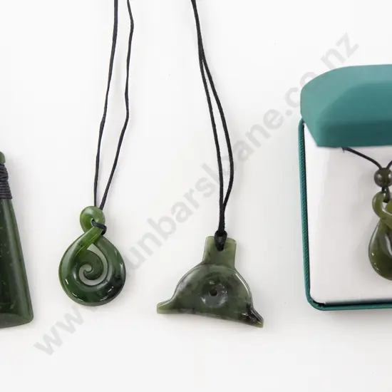Four Greenstone Pendants