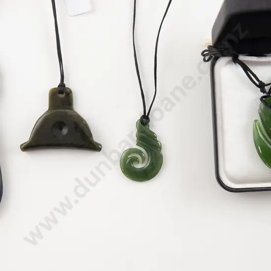 Four Greenstone Pendants