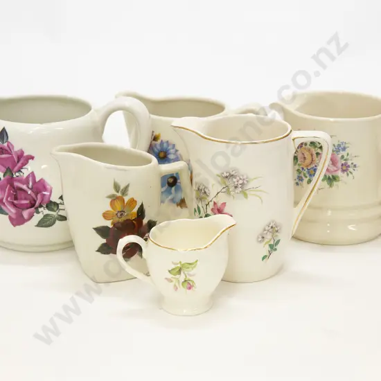 Six Assorted Floral Decorated Jugs