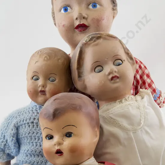 Four Composition Dolls