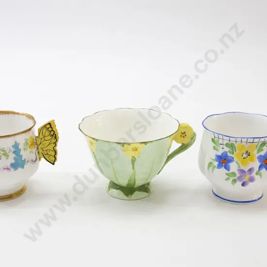 Two Butterfly Handled Teacups and One Other