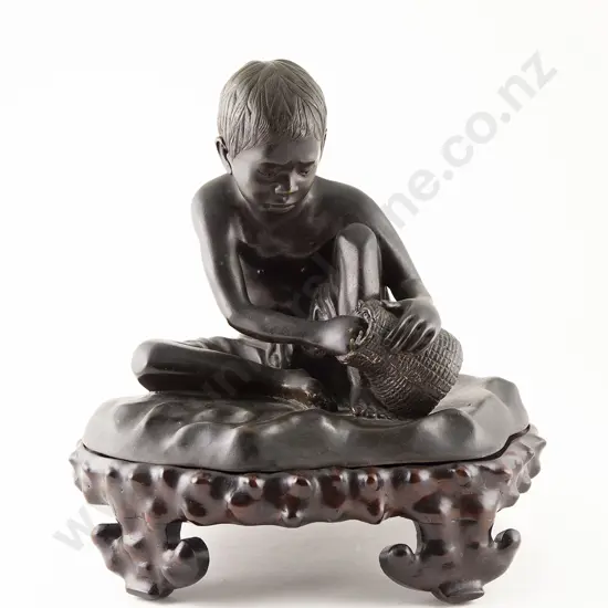 Asian Bronze of Seated Boy With Basket