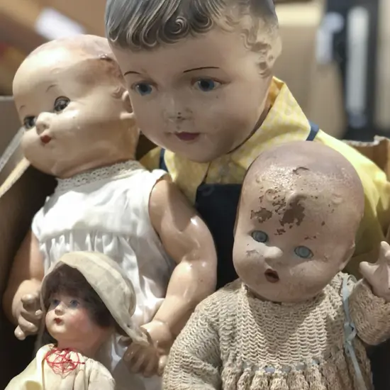 Four Composition Dolls