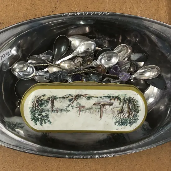 Plated Bowl With Assorted Spoons and Tin