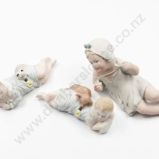 Pair and Single New Bisque Piano Baby’s