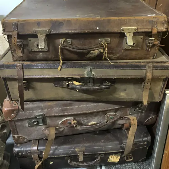 Four Vintage Leather Suitcases