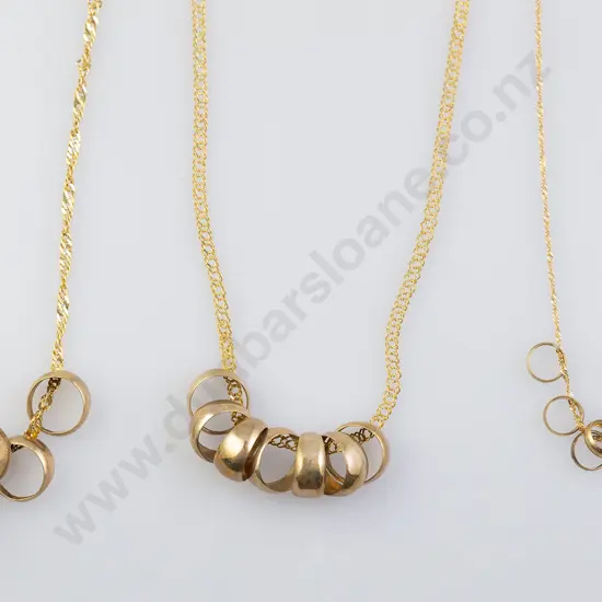 Two 9ct Seven 'Lucky Rings' Pendant Necklaces