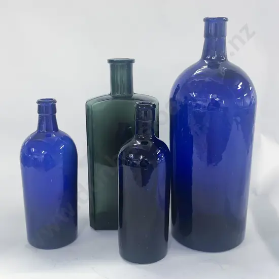 Four Vintage Colored Glass Bottles