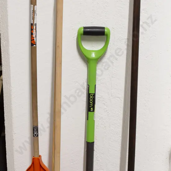 Four Garden Tools and a Brush