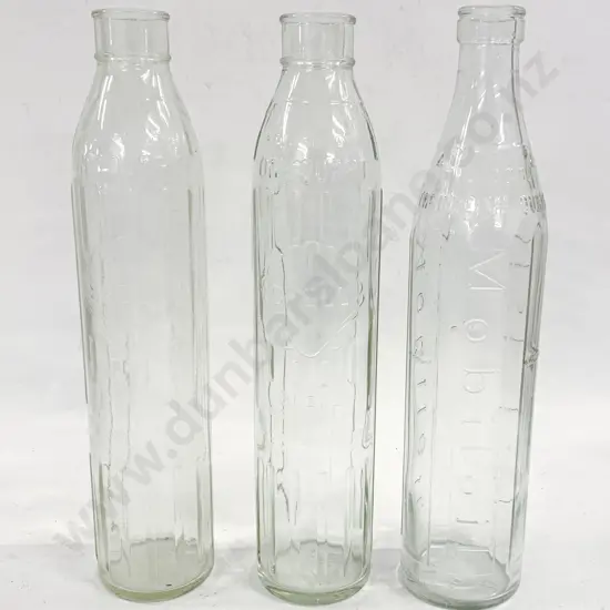 Three Shell and Mobil Oil Bottles