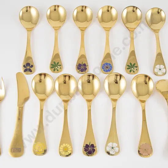 Twelve George Jensen S/S Gilt Year Spoons & Knife & Fork