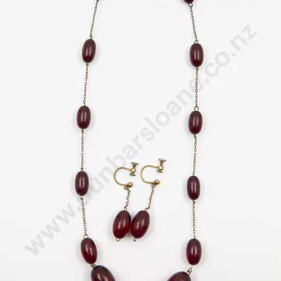 Two Art Nouveau Silver and Carnelian Brooches and Small Drop Pendant