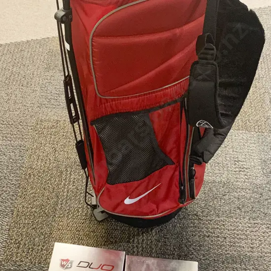 Golf Club Bag Together With Four Boxes of Golf Balls