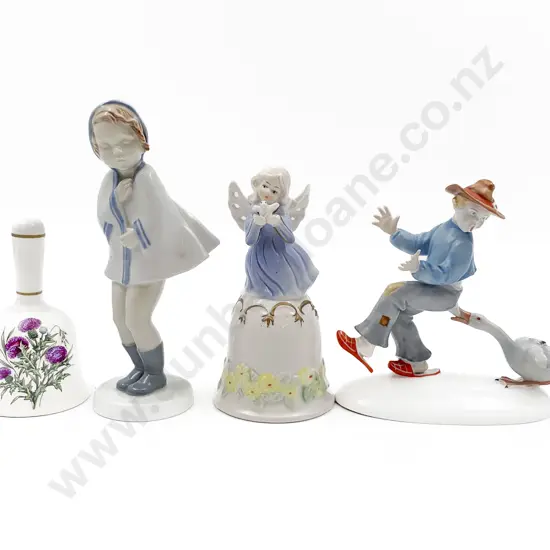 Two China Figures Together With Two Bells