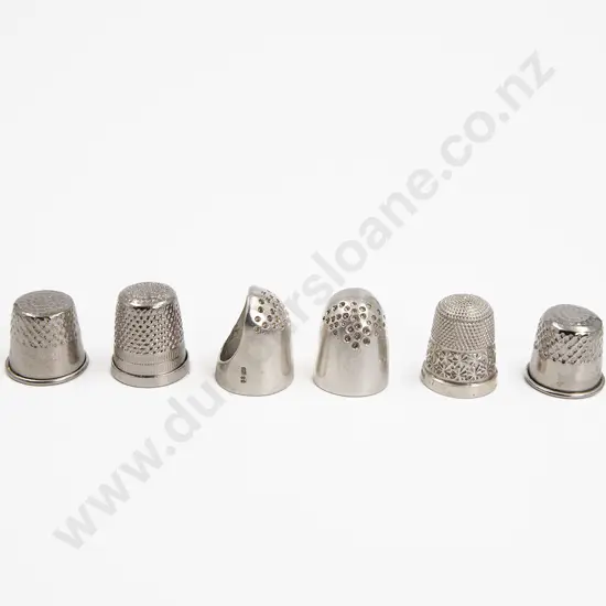 Two S/S Finger Guards S/S Thimble and three plated thimbles
