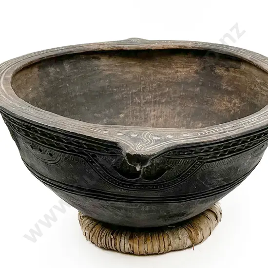 A large and impressive 19th century Trobriand Islands blackened pottery feast bowl