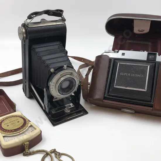Two Vintage Cameras Together with Light Meter