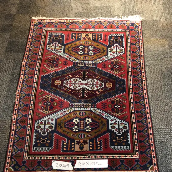 Small Persian Rug on Red Ground
