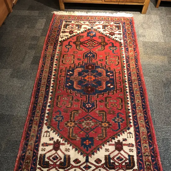 Persian Floor Rug on Red Ground (Small Tear)