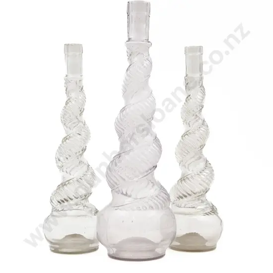 Three Spiral Moulded Glass Decanters