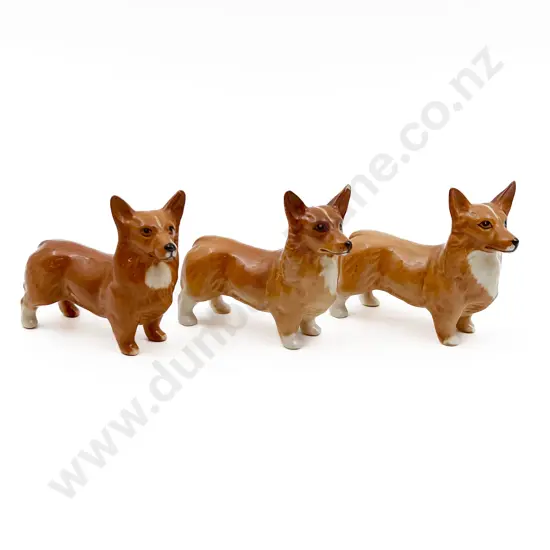 Three Beswick Dog Ornaments (One with Ear Chip)