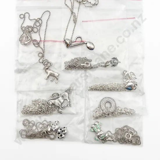 Eight Assorted S/S Charms on Chain