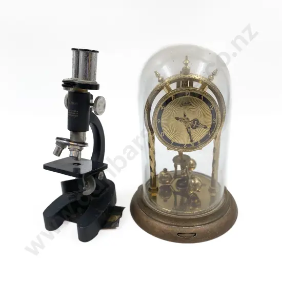 Dome Cased Clock Together with Microscope