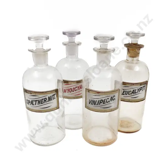 Four Labeled Stoppered Chemist Bottles