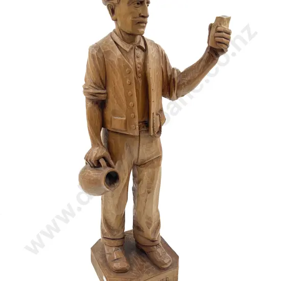 German Wooden Carving of Man With Jug