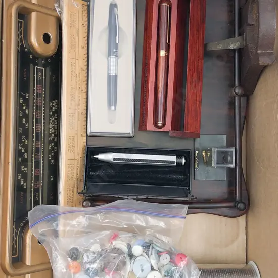 Quantity of Assorted Desk Items Together With Buttons etc
