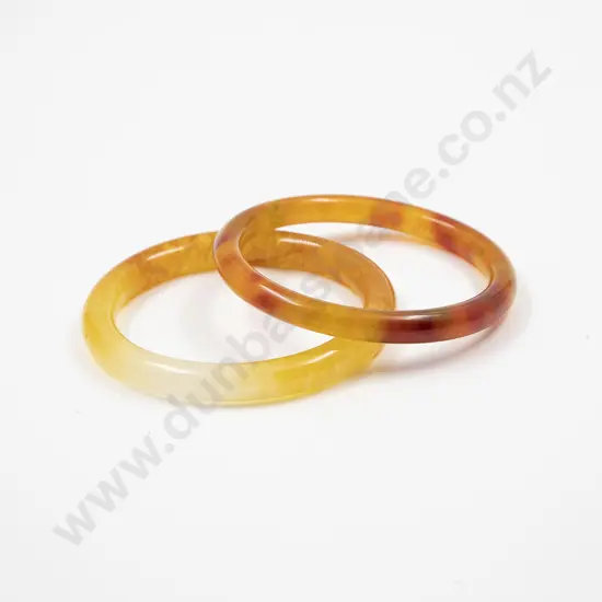 Two Chinese Mottled Orange Jade Bangles