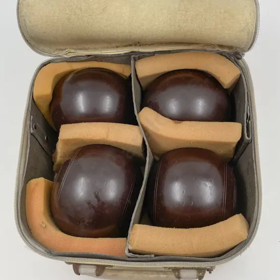 Four Lawn Bowls in Case