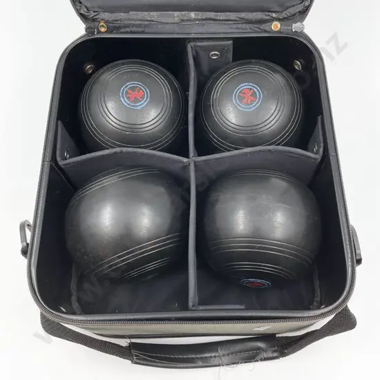 Four Lawn Bowls in Case