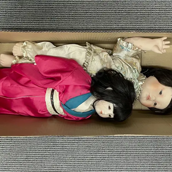 Two Porcelain Dolls