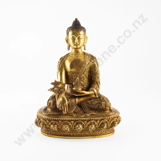 A Gilt Bronze Medicine Buddha Statue