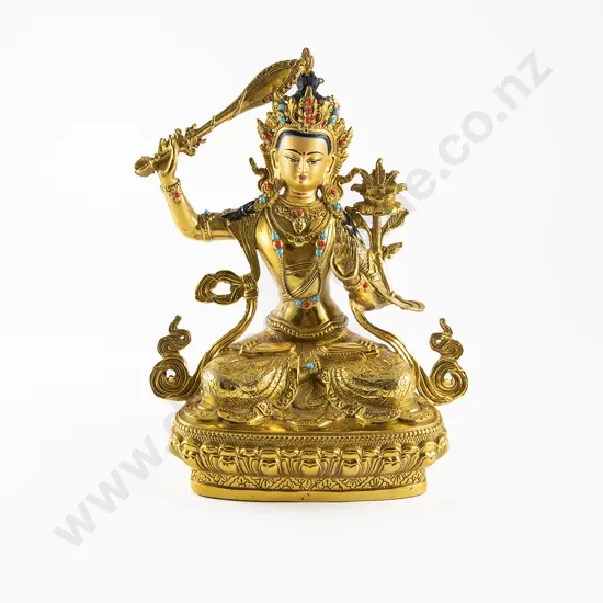 A Nepalese Gilt Brass Statue of Manjushri